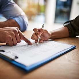 Two people reviewing insurance document?