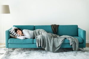 Woman napping on her sofa